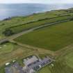 Oblique aerial view from north-west showing Recreation (Golf Course) and proposed area for development in Modern (Gunsgreenhill) Areas of Townscape Character, Eyemouth