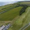 Oblique aerial view from north showing Recreation (Golf Course) and proposed area for development in Modern (Gunsgreenhill) Areas of Townscape Character, Eyemouth