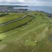 Oblique aerial view from south-east showing Recreation (Golf Course) and area for proposed development in Modern (Gunsgreenhill) Areas of Townscape Character, Eyemouth