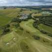 Oblique aerial view from north-east showing Recreation (Golf Course) and Industrial (Gunsgreenhill Industrial Estate) Areas of Townscape Character, Eyemouth