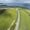 Oblique aerial view from south showing Recreation (Golf Course) and area for proposed development in Modern (Gunsgreenhill) Areas of Townscape Character, Eyemouth