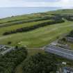 Oblique aerial view from north-west showing Recreation (Golf Course) and area for proposed development in Modern (Gunsgreenhill) Areas of Townscape Character, Eyemouth