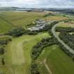 Oblique aerial view from north-north-east showing Recreation (Golf Course) and Industrial (Gunsgreenhill Industrial Estate) Areas of Townscape Character, Eyemouth