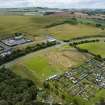 Oblique aerial view from north showing Recreation (Golf Course) and Industrial (Gunsgreenhill Industrial Estate) Areas of Townscape Character, Eyemouth