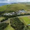 Oblique aerial view from north-north-west showing Recreation (Golf Course) and Industrial (Gunsgreenhill Industrial Estate) Areas of Townscape Character, Eyemouth