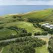 Oblique aerial view from north-west showing Recreation (Golf Course) and Industrial (Gunsgreenhill Industrial Estate) Areas of Townscape Character, Eyemouth