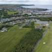 Oblique aerial view from south-east showing Recreation (Golf Course), Modern (Gunsgreenhill), Mid- to Late C20 (The Avenue) and Historic Burgh and Harbour Areas of Townscape Character, Eyemouth