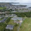 Oblique aerial view from east-south-east showing Recreation (Golf Course), Modern (Gunsgreenhill), Mid- to Late C20 (The Avenue) and Historic Burgh and Harbour Areas of Townscape Character, Eyemouth