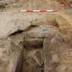 Excavation photograph, Detail of cap stones at north end taken from S, Keas Cottage, Spinningdale, Highlands