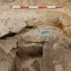 Excavation photograph, Detail of cap stones at north end taken from S, Keas Cottage, Spinningdale, Highlands