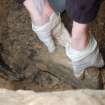 Excavation photograph, Lifting pillow stone, Keas Cottage, Spinningdale, Highlands