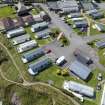 Oblique aerial view from east-north-east showing Recreation (Holiday Park) and Mid- to Late C20 (Barefoots) Areas of Townscape Character, Eyemouth