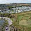 Oblique aerial view from north-east showing Recreation (Holiday Park), Mid- to Late C20 (Barefoots) and Mid- to Late C20 (Deanhead) Areas of Townscape Character, Eyemouth