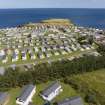 Oblique aerial view from south-west showing Recreation (Holiday Park) and Mid- to Late C20 (Barefoots) Areas of Townscape Character, Eyemouth