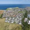 Oblique aerial view from south-west showing Modern (Acredale), Mid- to Late C20 (Deanhead) and Industrial (Acredale and Eyemouth Industrial Estates) Areas of Townscape Character, Eyemouth