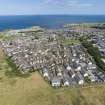 Oblique aerial view from west-south-west showing Modern (Acredale), Mid- to Late C20 (Deanhead) and Industrial (Acredale and Eyemouth Industrial Estates) Areas of Townscape Character, Eyemouth