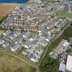 Oblique aerial view from south-west showing Modern (Acredale), Mid- to Late C20 (Deanhead) and Industrial (Acredale and Eyemouth Industrial Estates) Areas of Townscape Character, Eyemouth