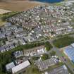 Oblique aerial view from south showing Modern (Acredale), Mid- to Late C20 (Deanhead) and Industrial (Acredale and Eyemouth Industrial Estates) Areas of Townscape Character, Eyemouth