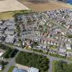 Oblique aerial view from south-east showing Modern (Acredale), Mid- to Late C20 (Deanhead) and Industrial (Acredale and Eyemouth Industrial Estates) Areas of Townscape Character, Eyemouth