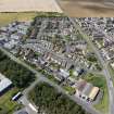 Oblique aerial view from east-south-east showing Modern (Acredale), Mid- to Late C20 (Deanhead) and Industrial (Acredale and Eyemouth Industrial Estates) Areas of Townscape Character, Eyemouth