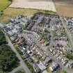 Oblique aerial view from east-south-east showing Modern (Acredale), Mid- to Late C20 (Deanhead) and Industrial (Acredale and Eyemouth Industrial Estates) Areas of Townscape Character, Eyemouth