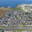 Oblique aerial view from south-south-west showing Modern (Acredale), Mid- to Late C20 (Deanhead), Mid- to Late C20 (Barefoots) and Recreation (Holiday Park) Areas of Townscape Character, Eyemouth