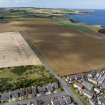 Oblique aerial view from south-east showing Modern (Acredale) and Mid- to Late C20 (Deanhead) Areas of Townscape Character, Eyemouth