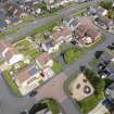 Oblique aerial view from south-west showing Modern (Acredale) and Mid- to Late C20 (Deanhead) Areas of Townscape Character, Eyemouth