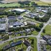 Oblique aerial view from north-east showing Industrial (Acredale and Eyemouth Industrial Estates), Mid- to Late C20 (Deanhead) and Inter-War (Hurkur Crescent and Schools) Areas of Townscape Character, Eyemouth