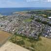 Oblique aerial view from west showing Modern (Acredale), Mid- to Late C20 (Deanhead) and Industrial (Acredale and Eyemouth Industrial Estates) Areas of Townscape Character, Eyemouth