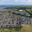 Oblique aerial view from north-west showing Modern (Acredale), Mid- to Late C20 (Deanhead) and Industrial (Acredale and Eyemouth Industrial Estates) Areas of Townscape Character, Eyemouth