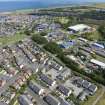 Oblique aerial view from north-west showing Modern (Acredale), Industrial (Acredale and Eyemouth Industrial Estates), Inter-War (Hurkur Crescent and Schools) and Mid- to Late C20 (Deanhead) Areas of Townscape Character, Eyemouth