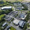 Oblique aerial view from east-south-east showing Industrial (Acredale and Eyemouth Industrial Estates), Modern (Acredale) and Inter-War (Hurkur Crescent and Schools) Areas of Townscape Character, Eyemouth