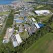 Oblique aerial view from south-west showing Modern (Acredale), Industrial (Acredale and Eyemouth Industrial Estates), Mid- to Late C20 (Deanhead), Inter-War (Hurkur Crescent and Schools) and Mid- to Late C20 (Gillsland) Areas of Townscape Character, Eyemouth