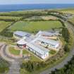 Oblique aerial view from west showing Modern (Gunsgreenhill) Area of Townscape Character, Eyemouth