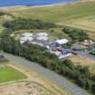 Oblique aerial view from north-west showing Industrial (Gunsgreenhill Industrial Estate) and Recreation (Golf Course) Areas of Townscape Character, Eyemouth