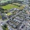 Oblique aerial view from north-east showing Inter-War (Hurkur Crescent and Schools) and Victorian Expansion Areas of Townscape Character, Eyemouth