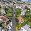 Oblique aerial view from south-east showing Inter-War (Hurkur Crescent and Schools) Area of Townscape Character, Eyemouth