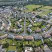 Oblique aerial view from north-west showing Inter-War (Hurkur Crescent and Schools), Mid- to Late C20 (Barefoots) and Industrial (Acredale and Eyemouth Industrial Estates) Areas of Townscape Character, Eyemouth