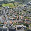 Oblique aerial view from north-west showing Inter-War (Hurkur Crescent and Schools) and Victorian Expansion Areas of Townscape Character, Eyemouth