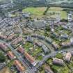 Oblique aerial view from north showing Inter-War (Hurkur Crescent and Schools) and Victorian Expansion Areas of Townscape Character, Eyemouth