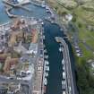 Oblique aerial view from south-west showing Historic Burgh and Harbour and Mid- to Late C20 (The Avenue) Areas of Townscape Character, Eyemouth