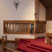 View of curved tabernacle and  window to linked monastic house beyond.