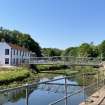 General view from north-east showing footbridge across the River Eye and offices for Eyemouth Boatbuilding Company, Brown's Bank, Historic Burgh and Harbour Area of Townscape Character, Eyemouth