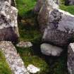 View of chambered cairn passage from NW.