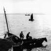 Bowmore Distillery, Bowmore, Islay.
Copy of historic photograph showing 'coaling' - delivery of coal from ship to shore via small boat and cartage.