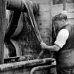 Aberdeen, Grandholm Works.
Cloth scouring; general view of a worker cloth scouring in building 27.