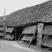 General view of main entrance on E wall of drying shed.