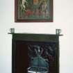 First Floor, East Room, detail of fireplace and painted heraldic panel.