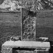 Iona, St John's Cross.
View of fragments of shaft and base.
Copy of original mounted photograph annotated by Erskine Beveridge 'Bossed Cross (near St Martin's), Iona (from east)'. From RCAHMS Society of Antiquaries Collection MS/36/209.